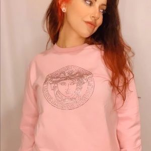 Woman’s Versace pink sweater